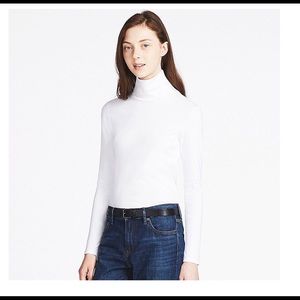 White turtle neck from Uniqlo. Brand New wit label