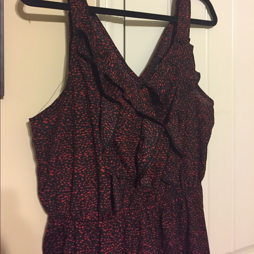 Ruffle front black dress with red spots
