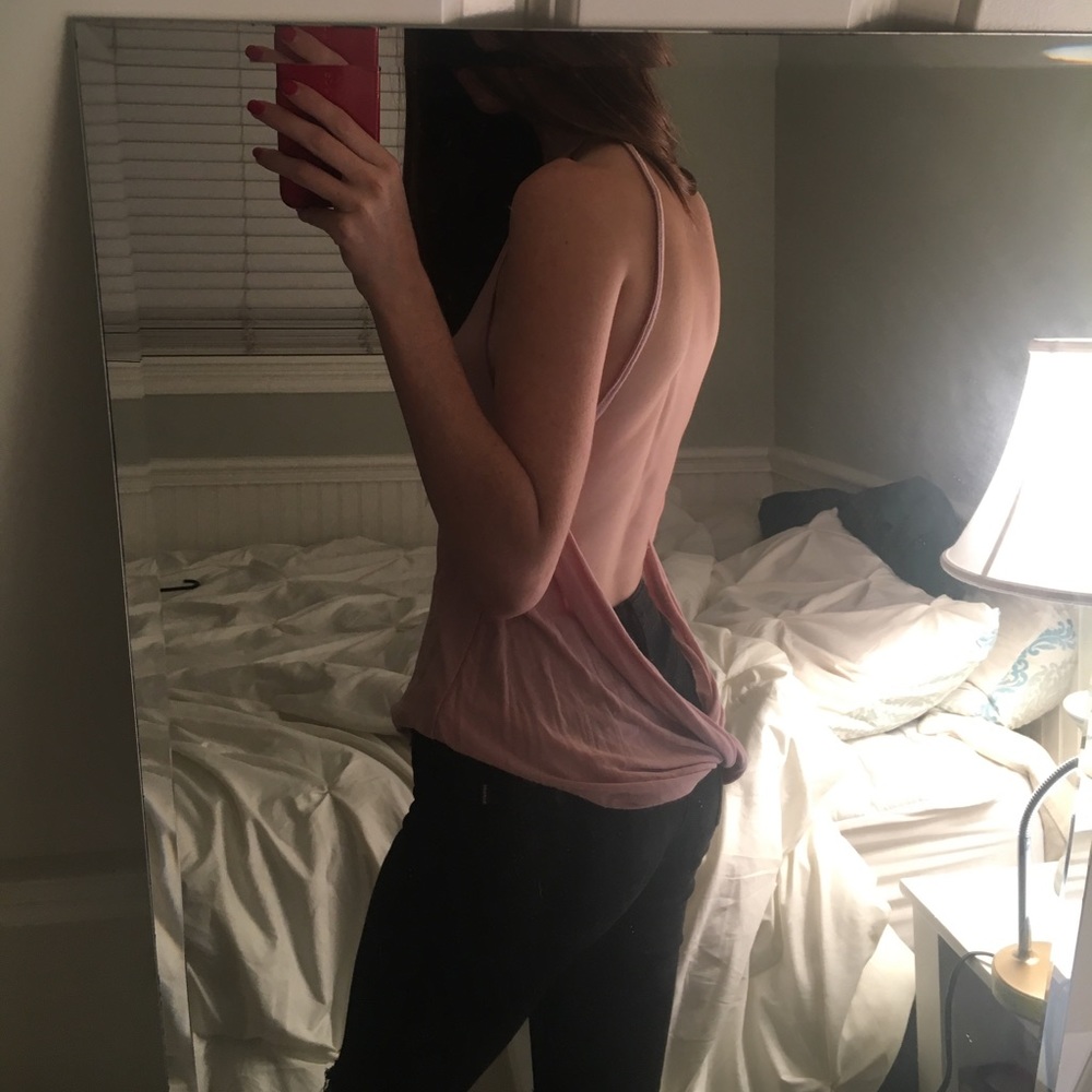 pink tank top that's low cut in the back
