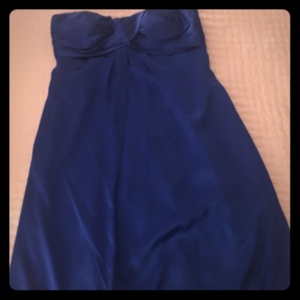 Short silk cache cocktail dress in royal blue.