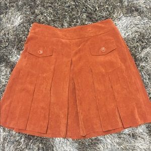 burnt orange pleated corduroy skirt