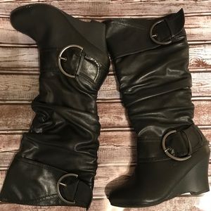 Black wedge boots that zip