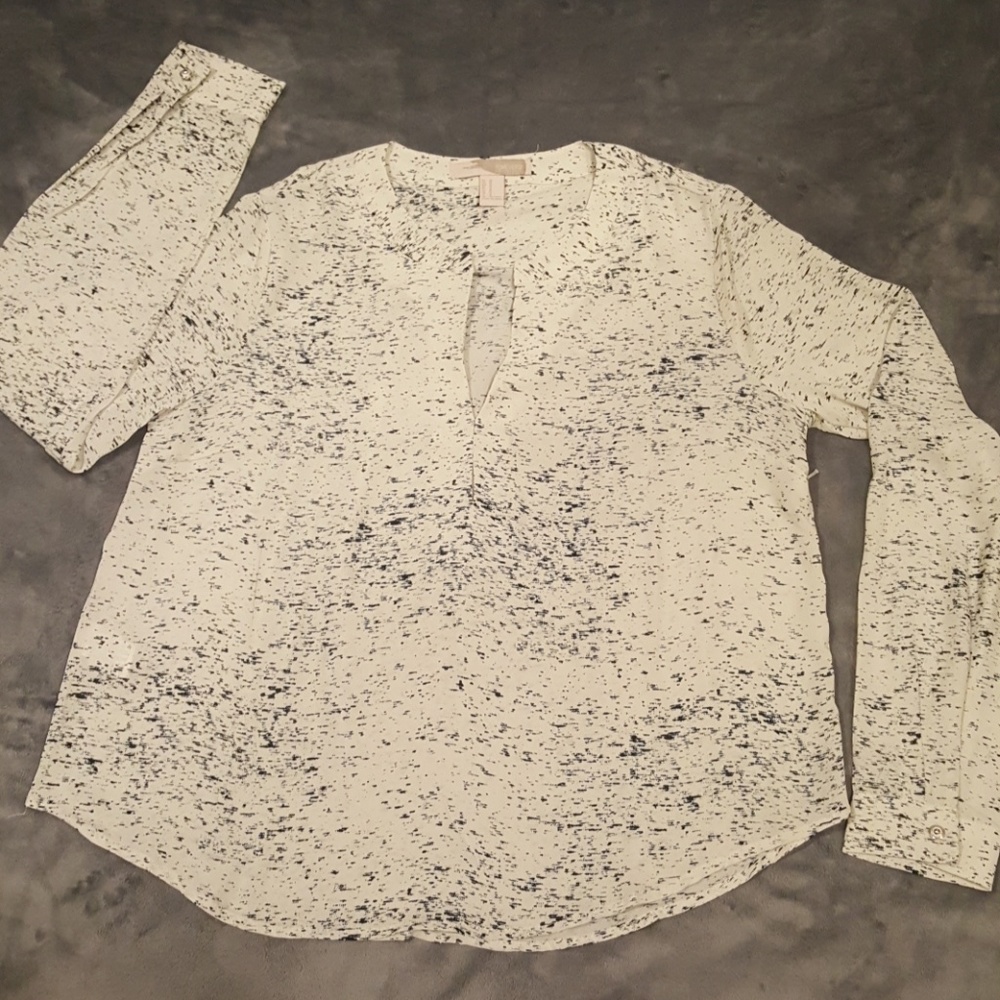 Black and white patterned blouse.