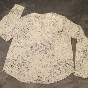 Black and white patterned blouse.