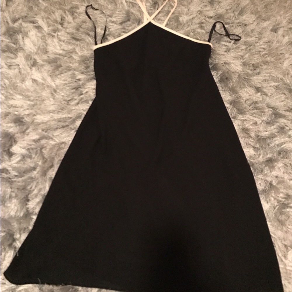 Black Dress! White around arms and neck!