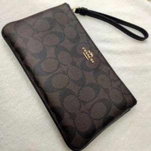 COACH - LARGE WRISTLET IN SIGNATURE COATED CANVAS