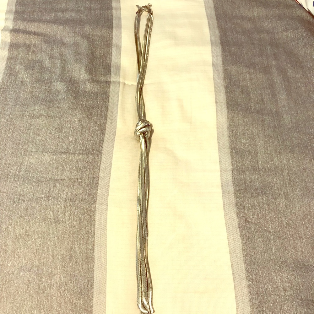 Unique silver knot necklace. NWOT never worn