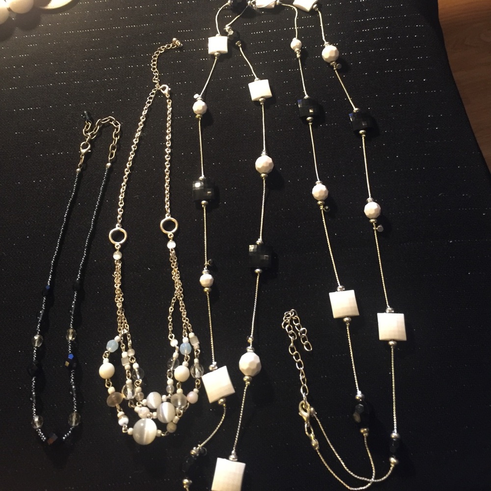 Lot of three multi media necklaces.