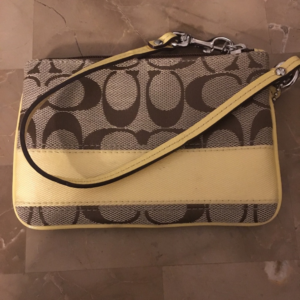 Small coach wristlet with yellow detail