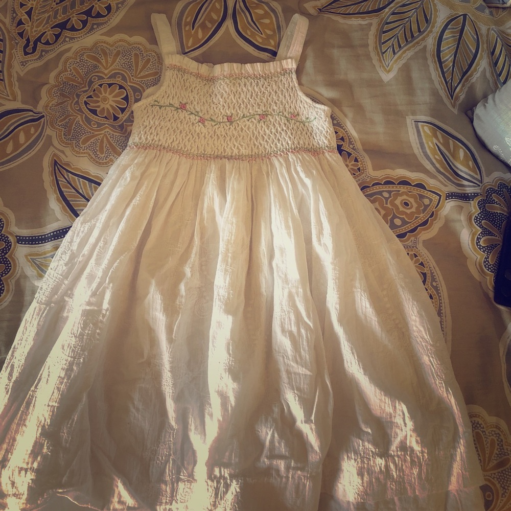 Girls Dress with floral detail on top.