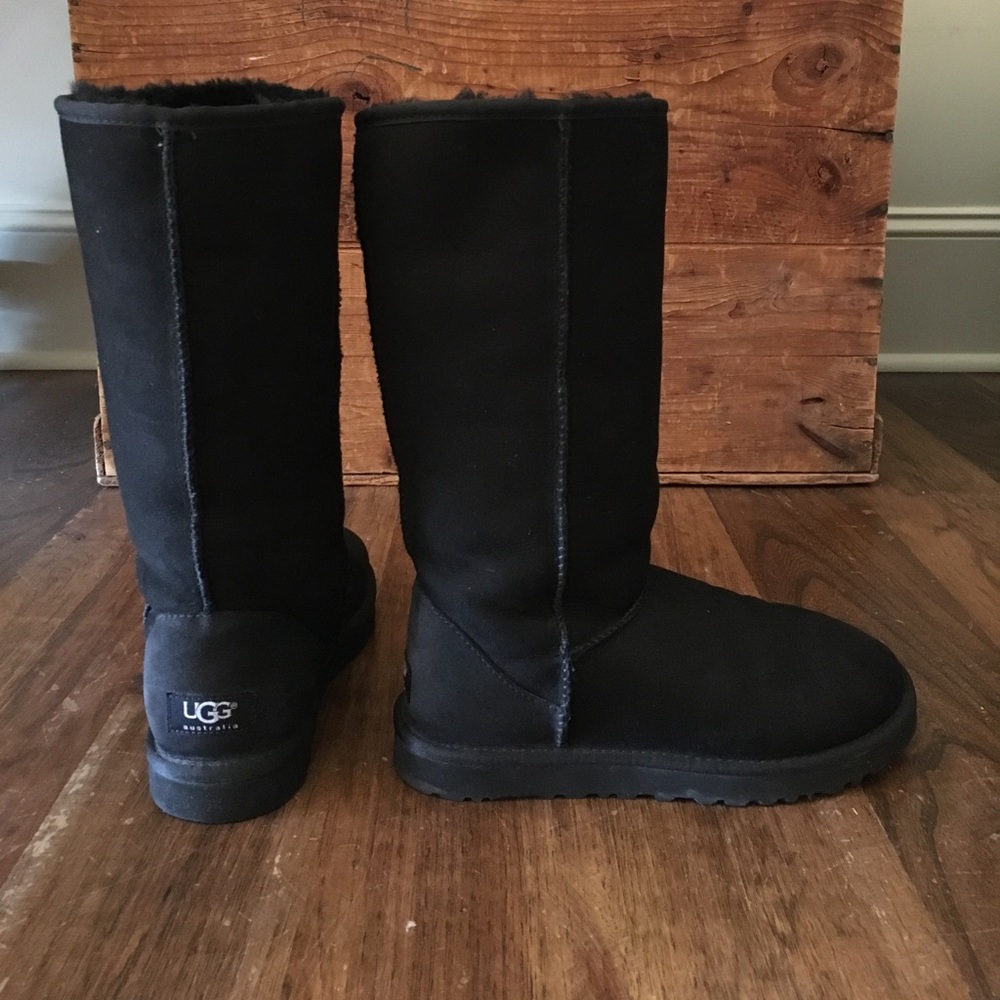 Black classic tall UGGs with sheepskin lining.