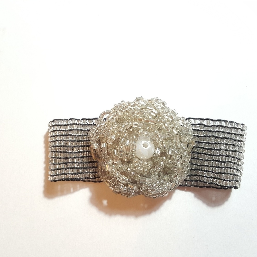 Stretch rosette style bracelet silver beaded