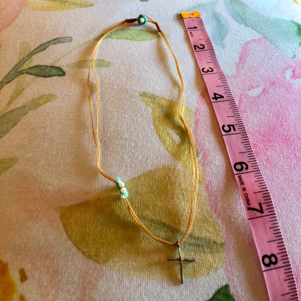 Handmade cross necklace.