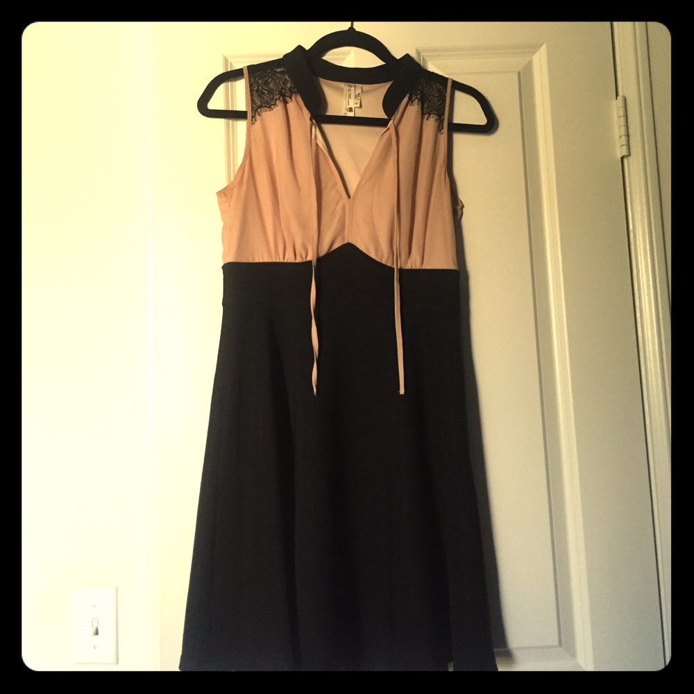 Nude and black fit and flare dress