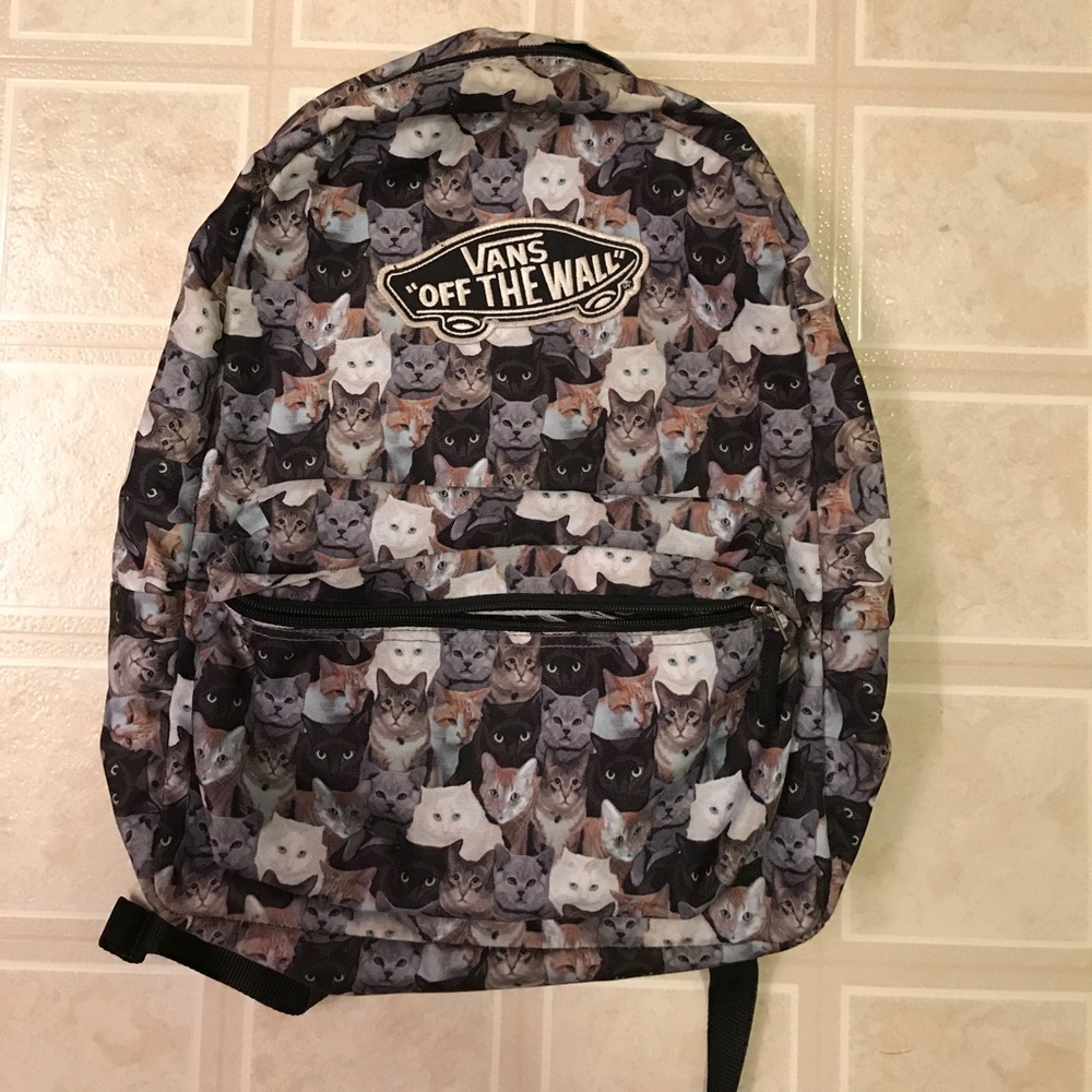 A Vans book bag - patterned with cats