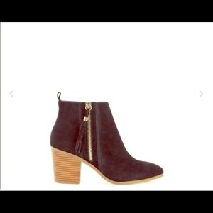 Black Booties with Fringe Zipper Detail.