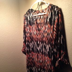A Cato blouse. Black and burnt orange pattern
