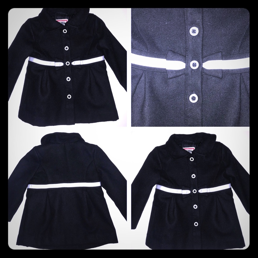 Black and white pea coat with a bow detailed belt