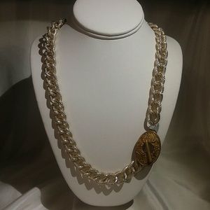 Gold chain with decorative toggle clasp