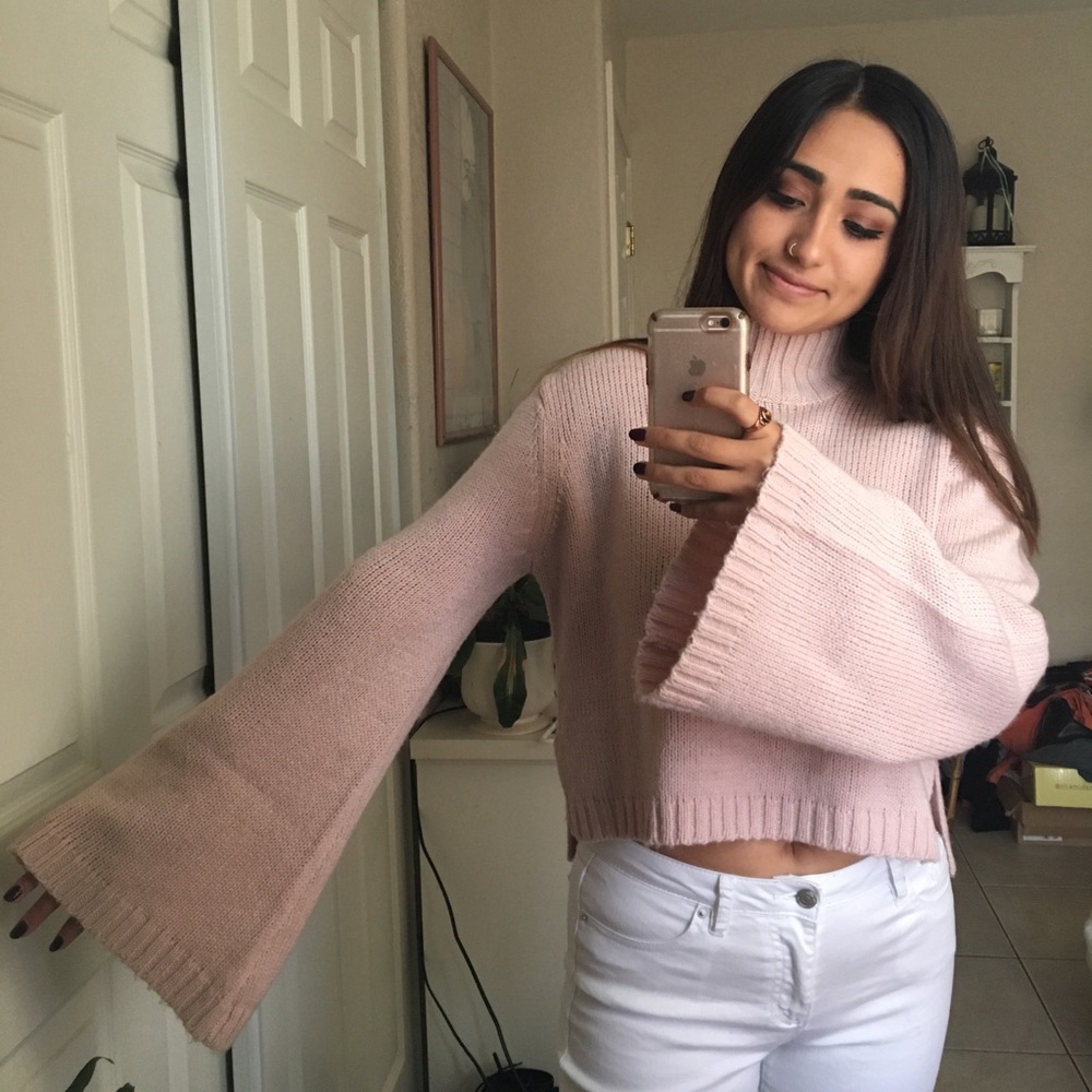 Pink turtleneck with bell sleeves