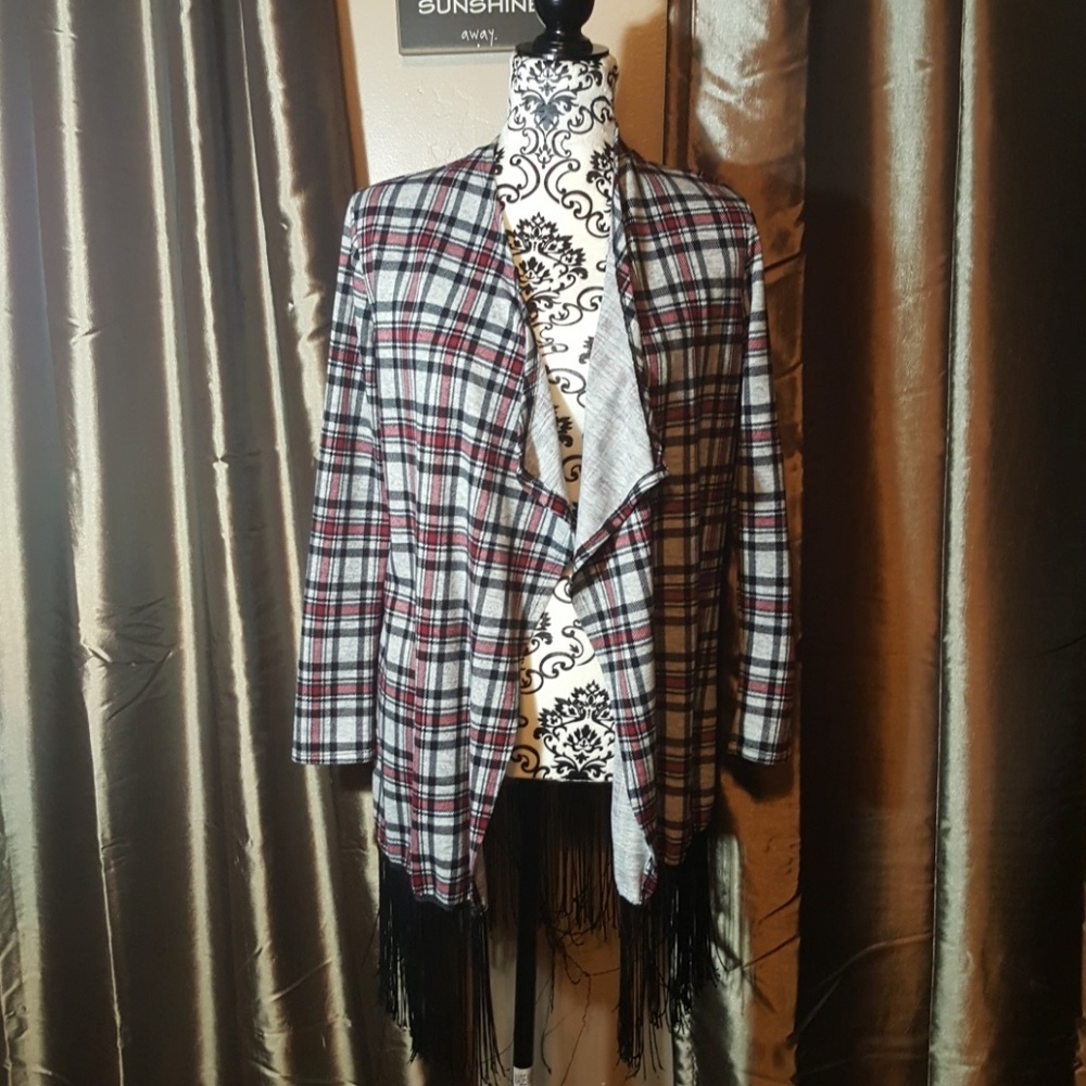 Cute plaid jacket with fringe along bottom