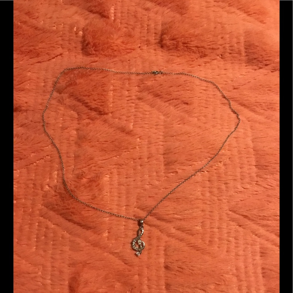 Treble clef necklace