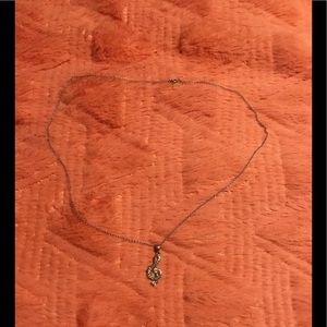 Treble clef necklace