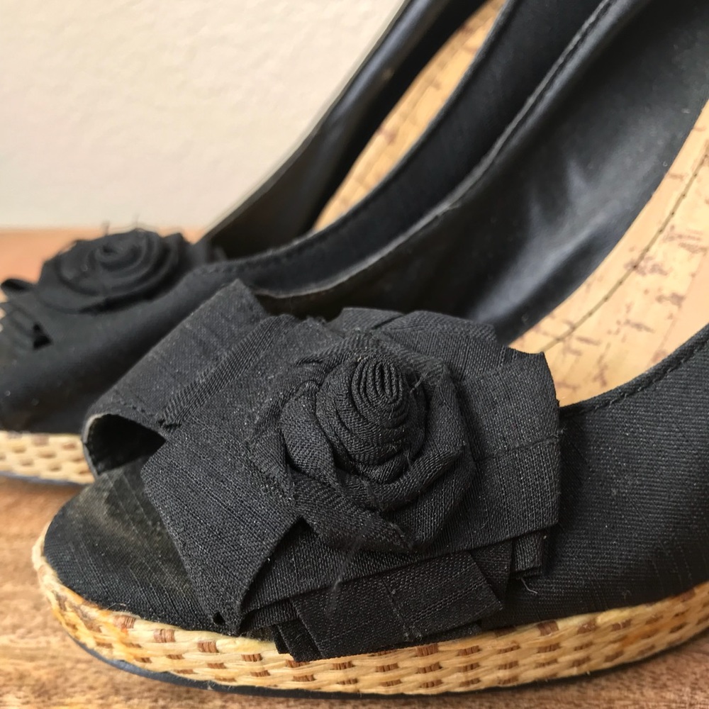 Black heels with wicker and floral detail