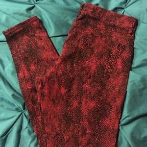 Express snake print red and black skinny jeans