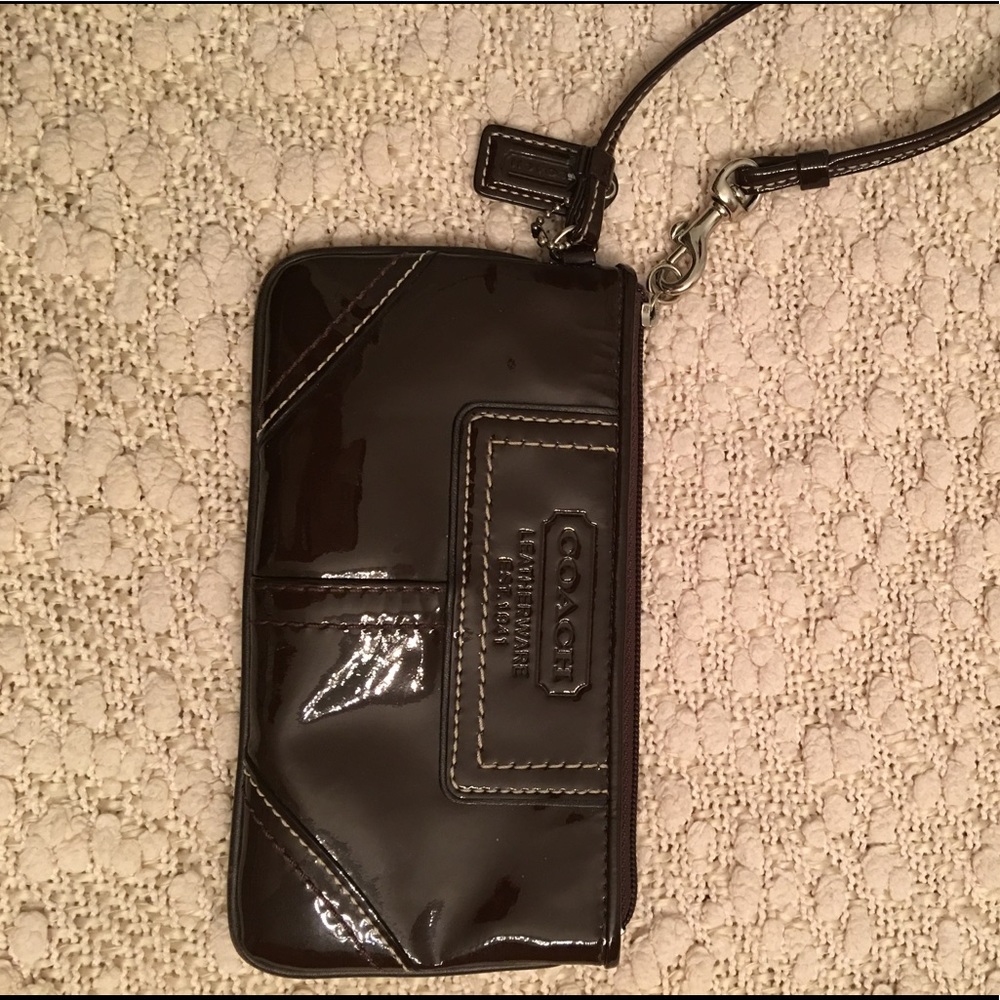 Brown patent leather Coach wristlet.