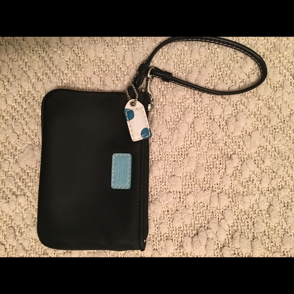Authentic black satin Coach wristlet.