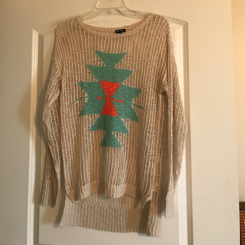 Open knit sweater with tribal pattern.