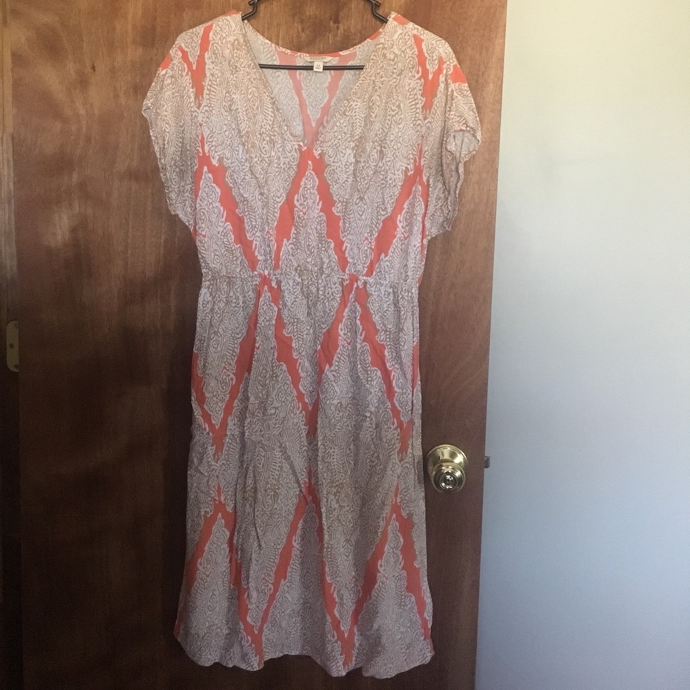 Tan and light orange patterned dress.