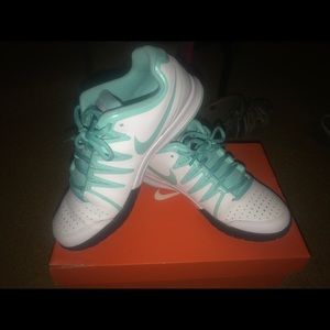 Black blue and white nike tennis shoes