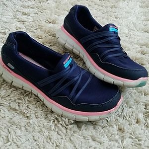 Skechers navy slip on walking shoes. 7.5