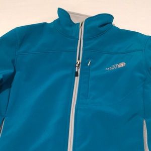 Teal colored North Face jacket
