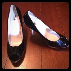 Black high heeled patten leather peep toe pumps