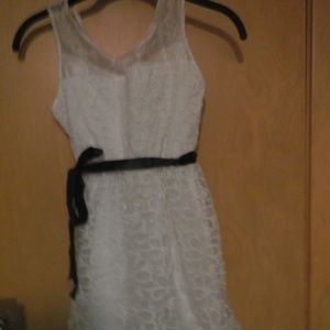 White embrodiered dress with black sash