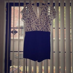 Navy blue spotted romper. Stretchy