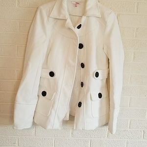White peacoat with black buttons