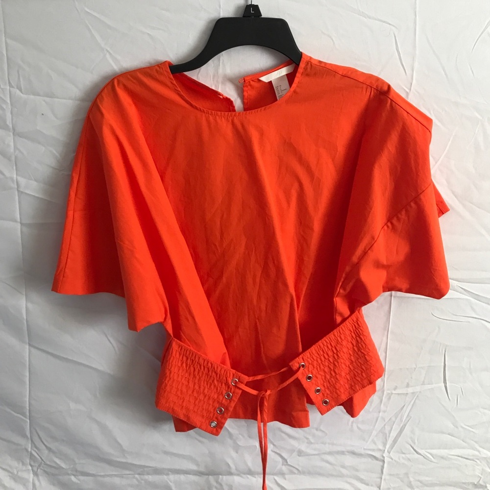 A bright orange top