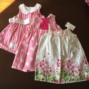 Lot of three dresses size 6-9 months