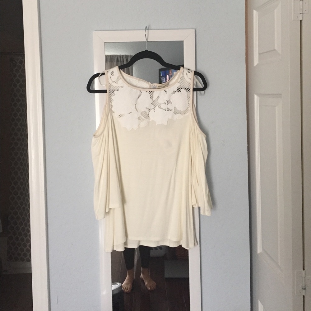 Cold Shoulder top with floral appliqué