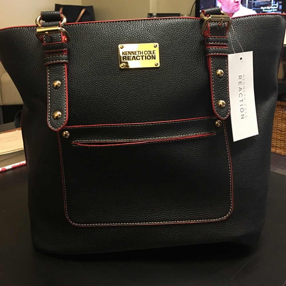 Kenneth Cole Reaction black bag with red trim.