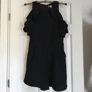 Francesca’s ruffle cold shoulder romper in black
