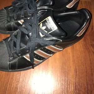 Black and gold adidas shoes