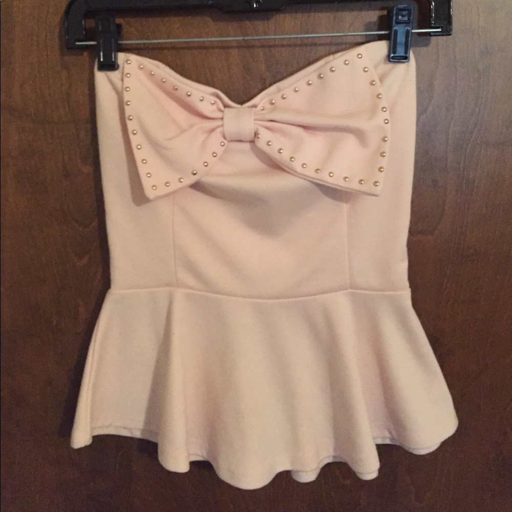 Peplum light pink sleeveless top