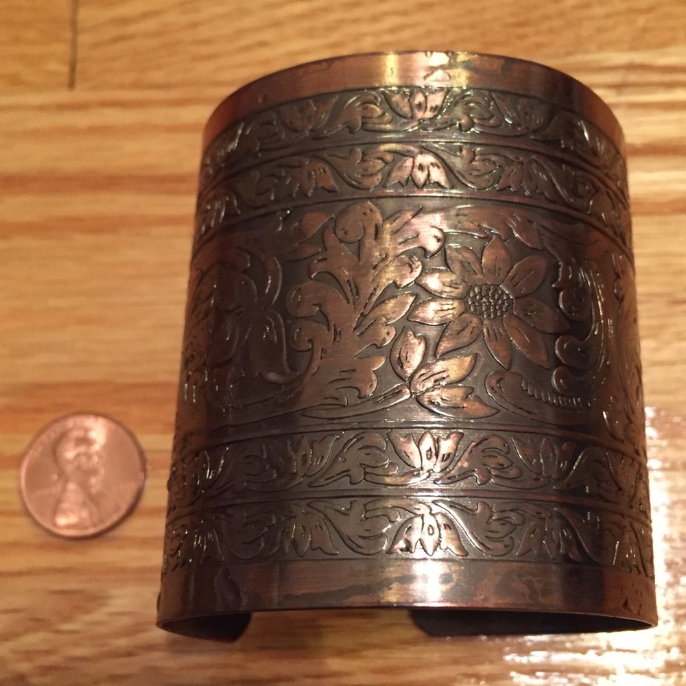 Copper cuff bracelet with pressed floral pattern
