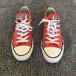 Red low top Chuck Taylor converse
