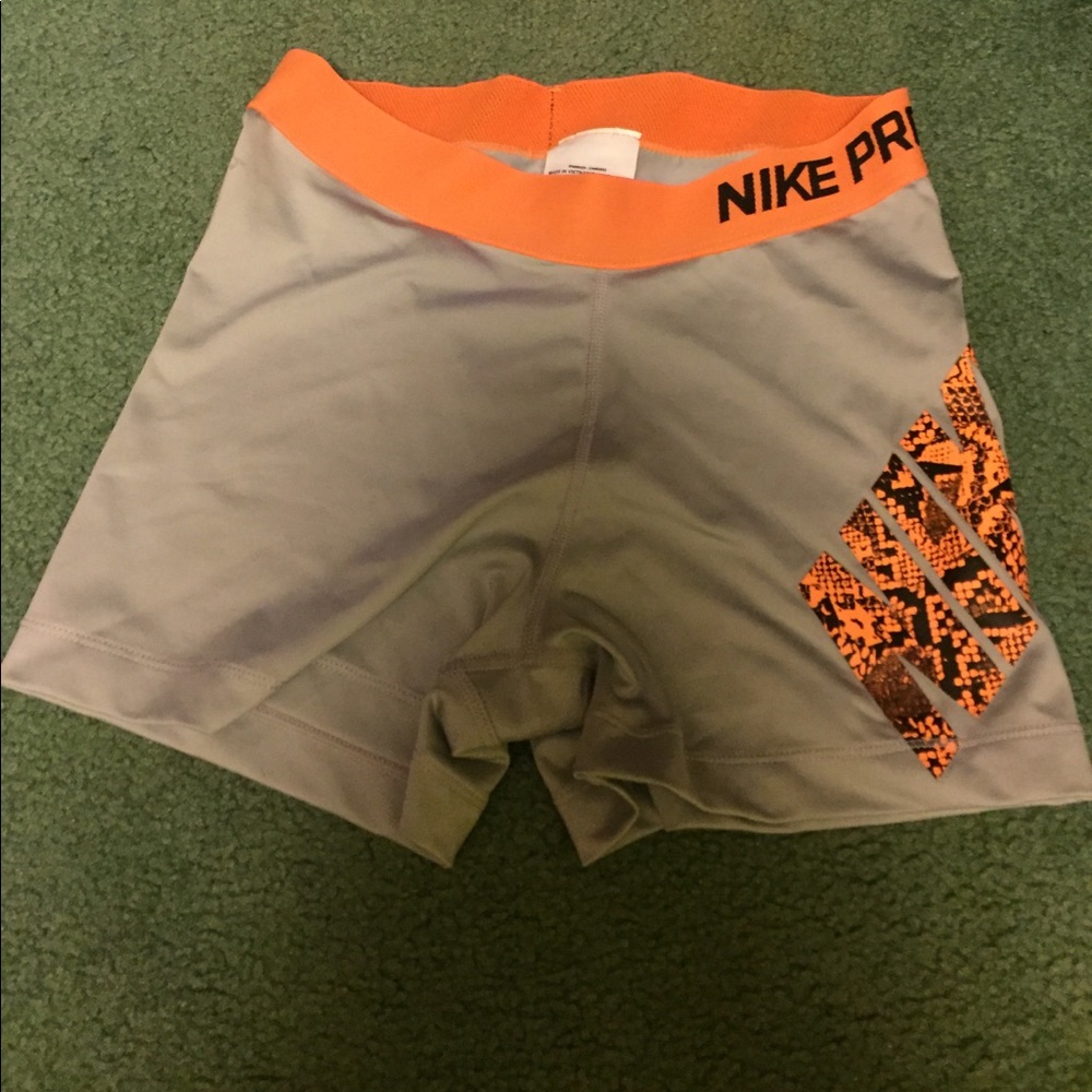 Orange snakeskin Nike Pros